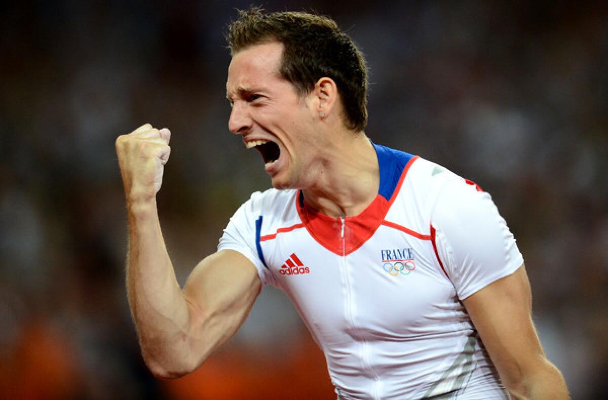 Renaud Lavillenie celebrates after winning the gold medal in the pole vault at the 2012 London Olympics.