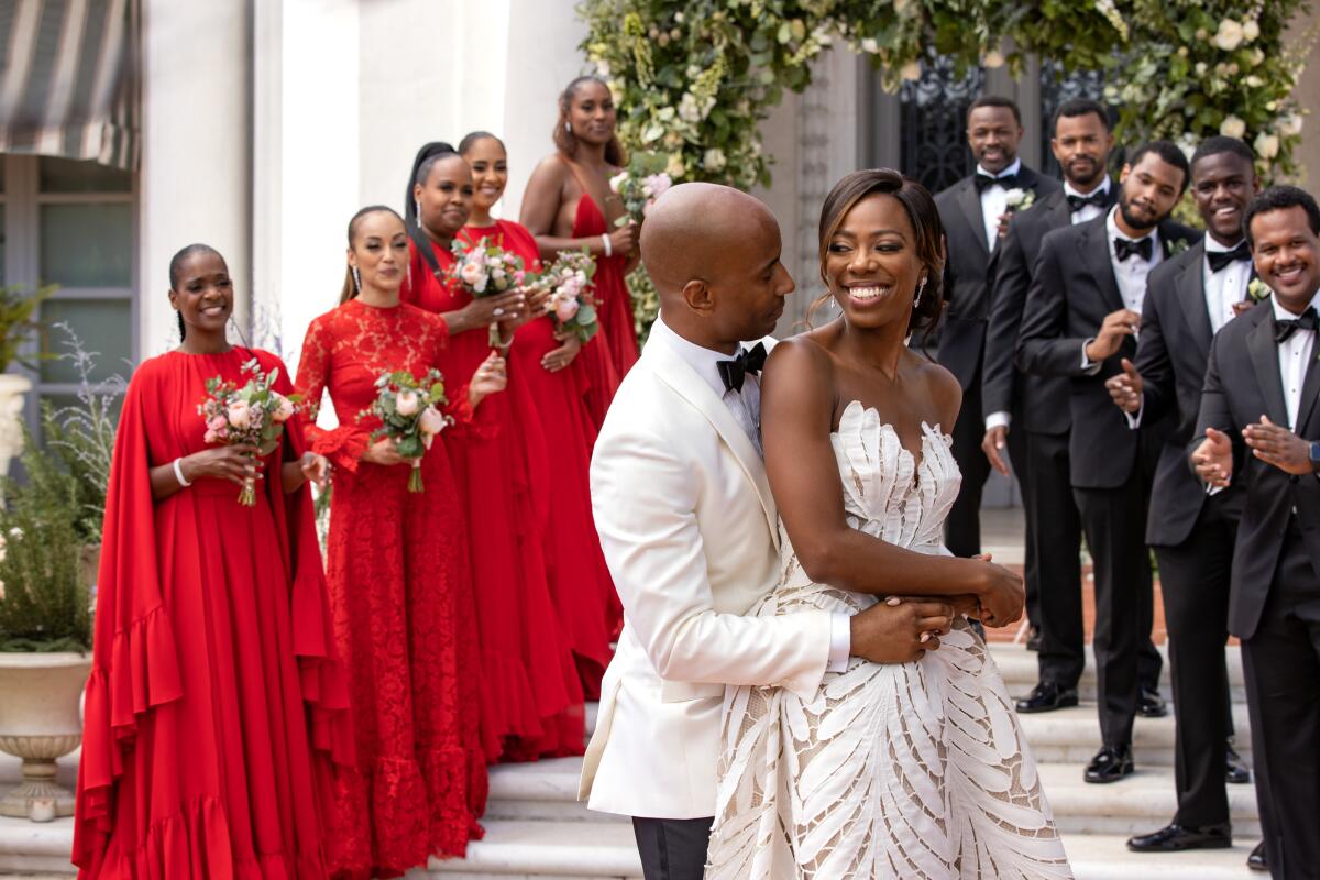 A bride and groom and wedding party