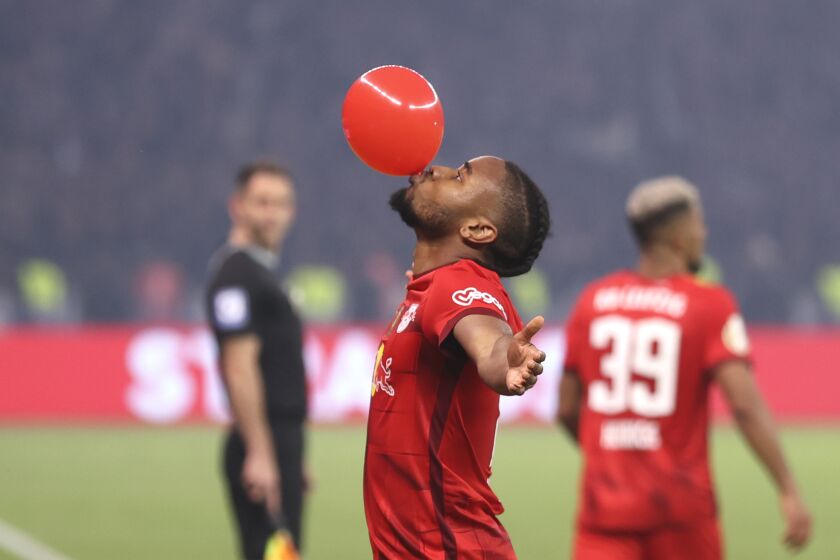 Leipzig's Christopher Nkunku celebrates after scoring his side's opening goal during the German soccer cup, DFB Pokal, final match between RB Leipzig and Eintracht Frankfurt at Olympiastadion in Berlin, Germany, Saturday, June 3, 2023. (AP Photo/Andreas Gora)