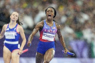 American Sha'carri Richardson cheers as she crosses the finish line to win the women's 4x100-meter relay final