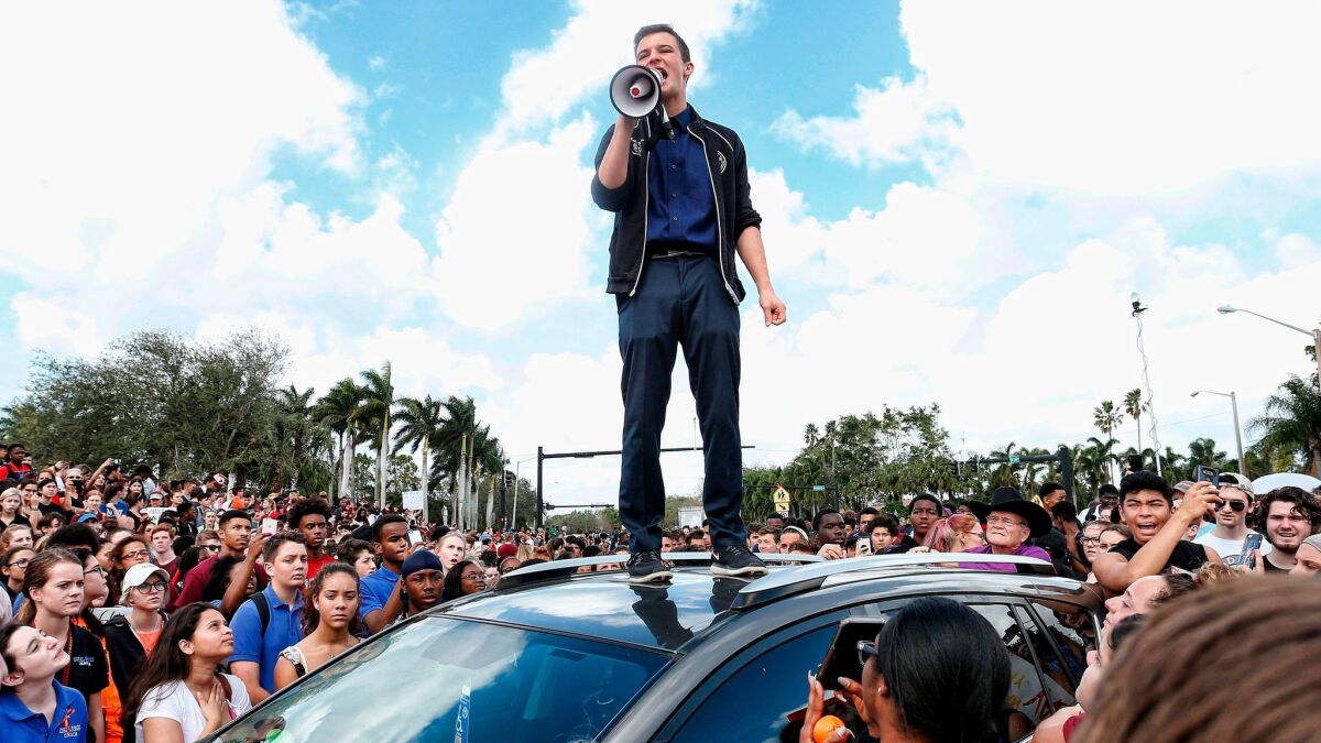 Cameron Kasky addresses students who rallied after a school walkout in Parkland, Fla.