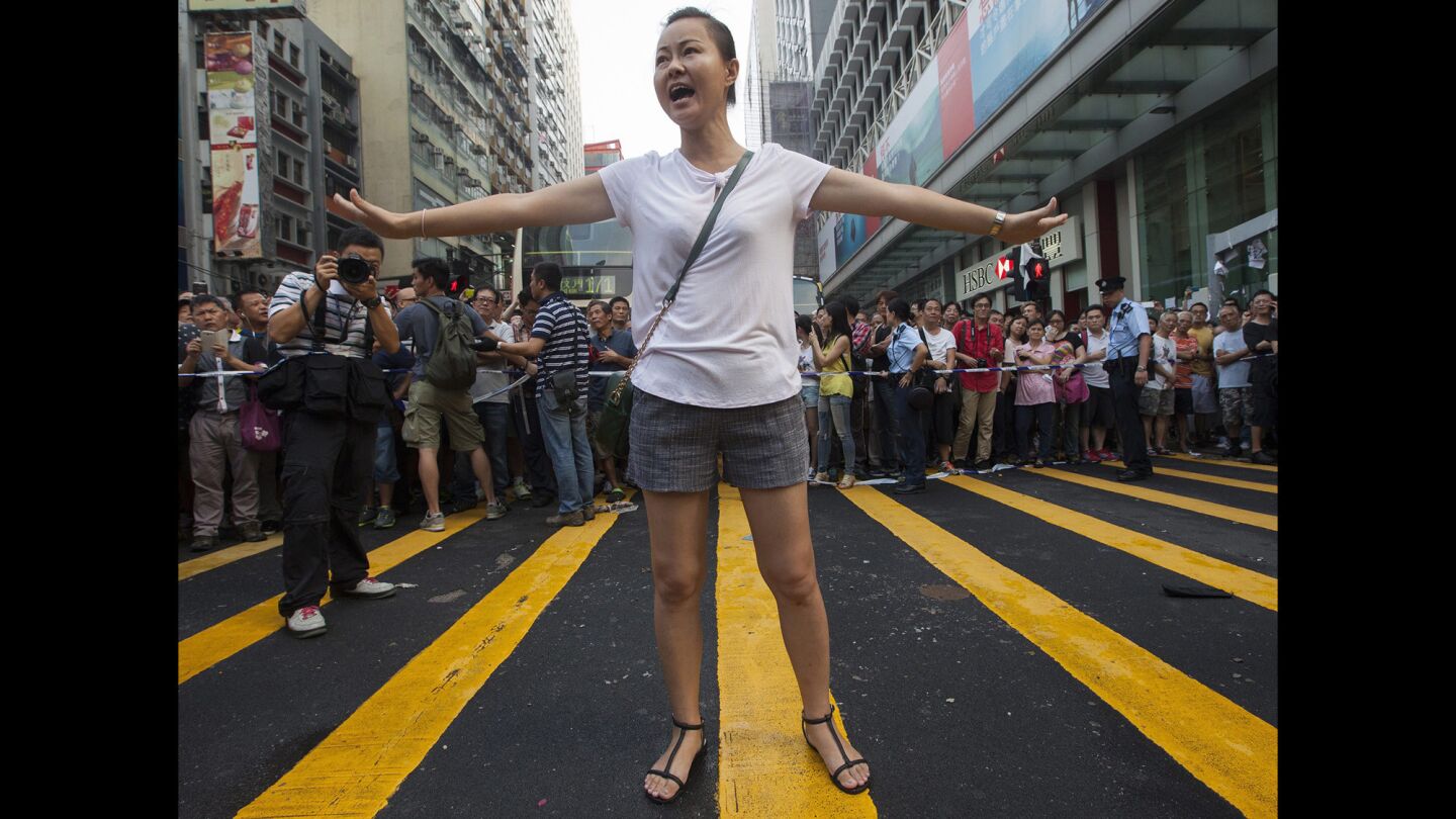 A woman shouts during violent scenes in Mong Kok on Day 6 of the mass civil disobedience campaign Occupy Central in Hong Kong.