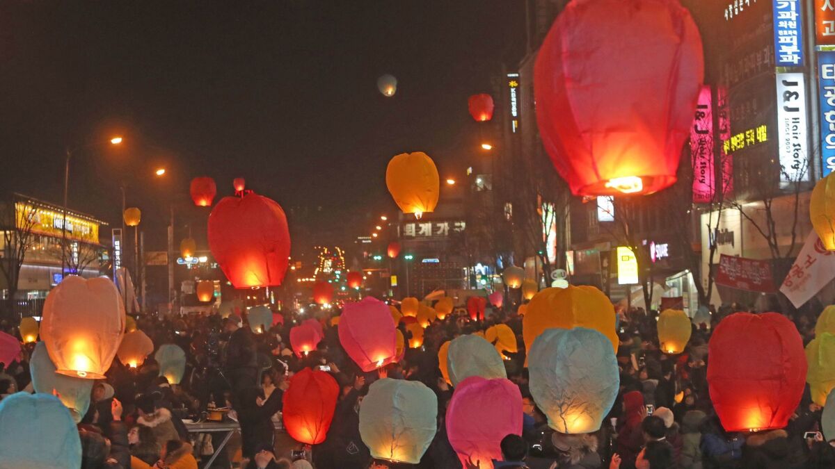 Protesters release paper lanterns into the air during a rally Saturday in Chuncheon, South Korea, calling for South Korean President Park Geun-hye to step down.
