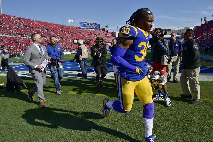 Todd Gurley runs off the field following the Rams' season finale against the Cardinals on Dec. 29 at the Coliseum.