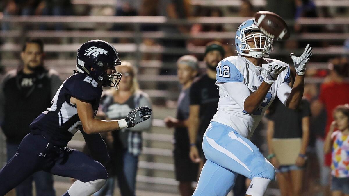 Corona del Mar High's TaeVeon Le makes a touchdown catch against Trabuco Hills' Colin Seedorf during a game on Sept. 29, 2017.