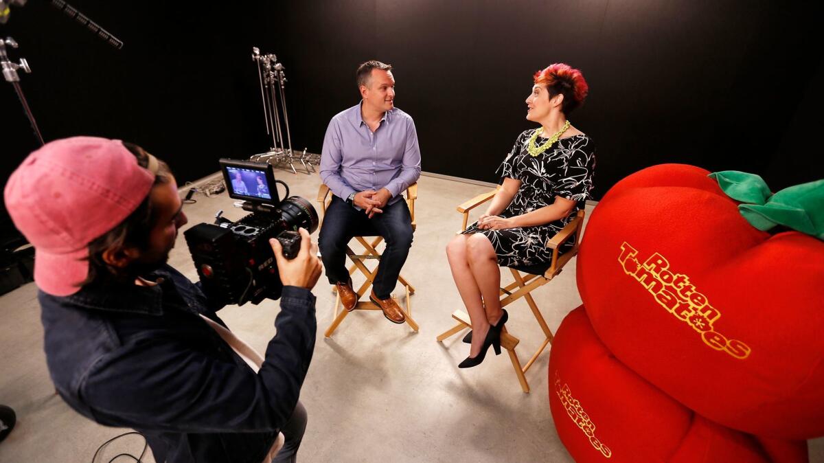 Rotten Tomatoes vice president Jeff Voris, middle, with senior editor Grae Drake, right, are filmed by creative director Jimmy Johenning at the Beverly Hills offices of the review aggregation website.