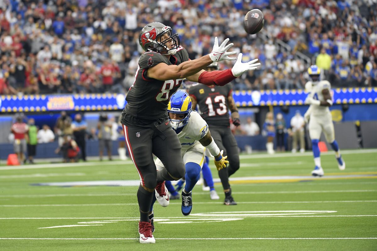 Tampa Bay Buccaneers tight end Rob Gronkowski reaches but cannot make a catch during the first half of an NFL football game against the Los Angeles Rams Sunday, Sept. 26, 2021, in Inglewood, Calif. (AP Photo/Kevork Djansezian)