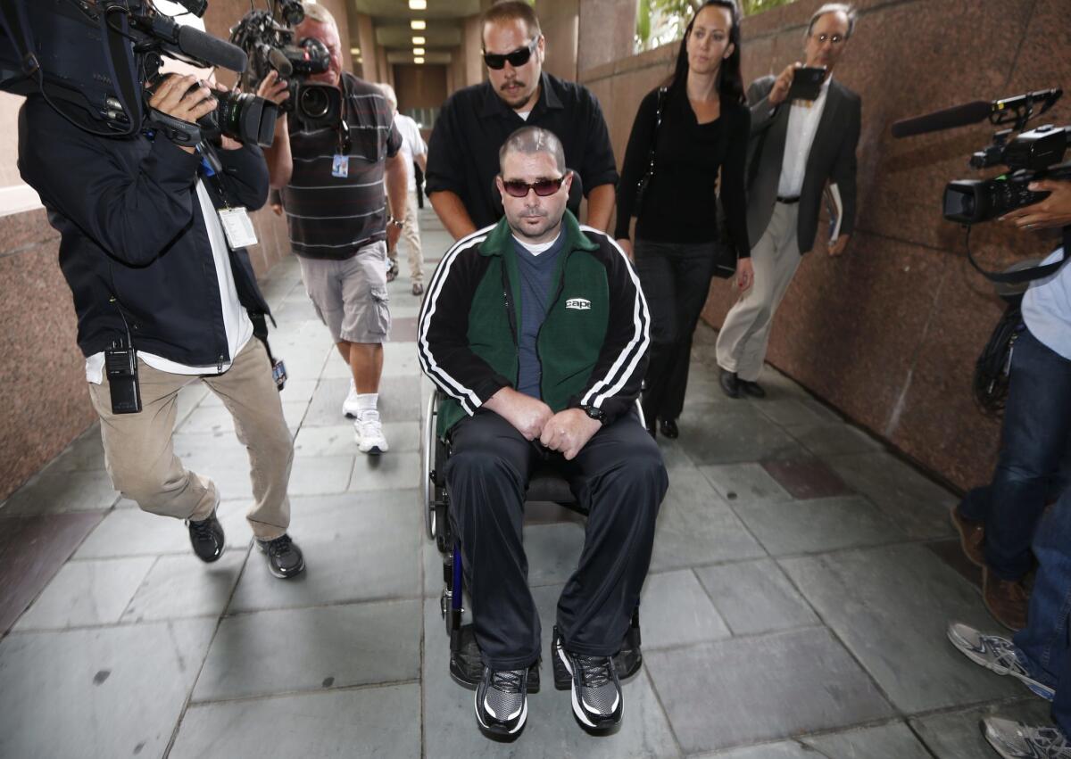 San Francisco Giants fan Bryan Stow arrives with his sister Bonnie Stow (second right) at a Los Angeles Court the day before closing arguments in a civil trial in a lawsuit brought by Stow.