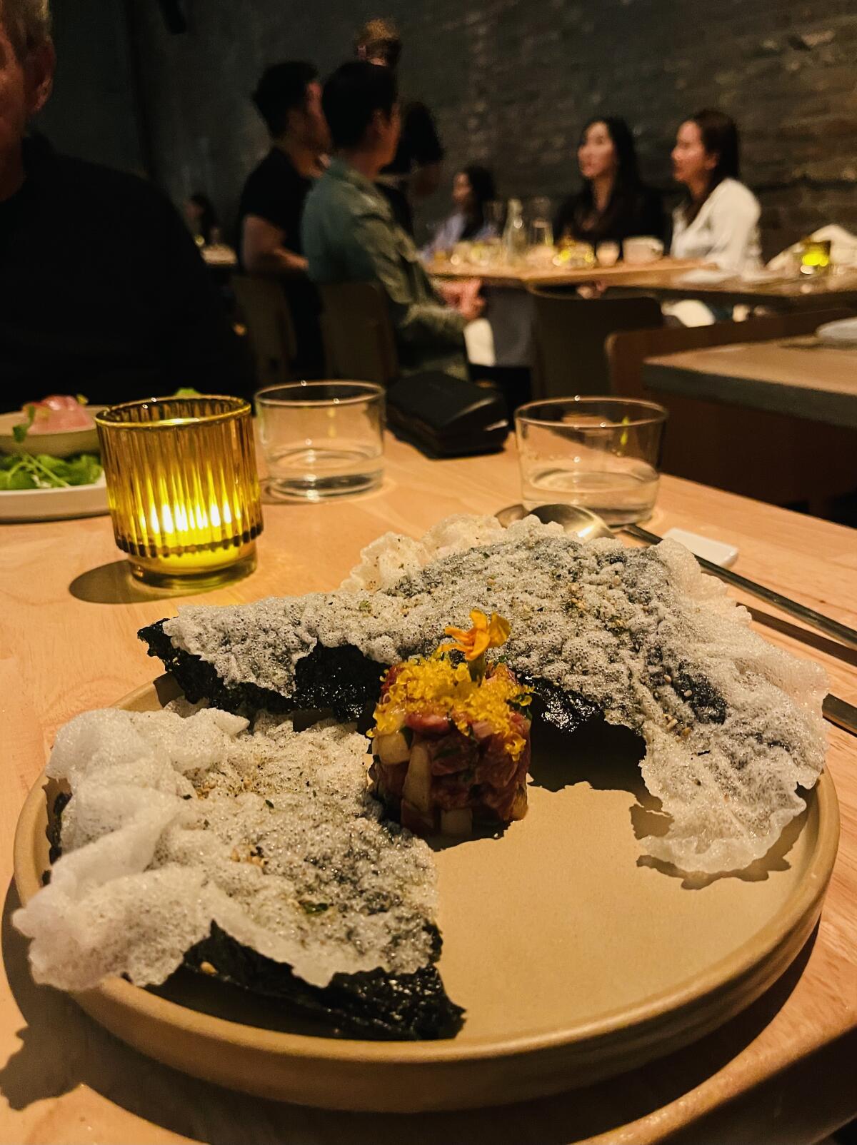 Wagyu beef tartare with Asian pear, salted egg yolk, perilla and seaweed cracker. Nov 2023 at chef Debbie Lee's Joseon.