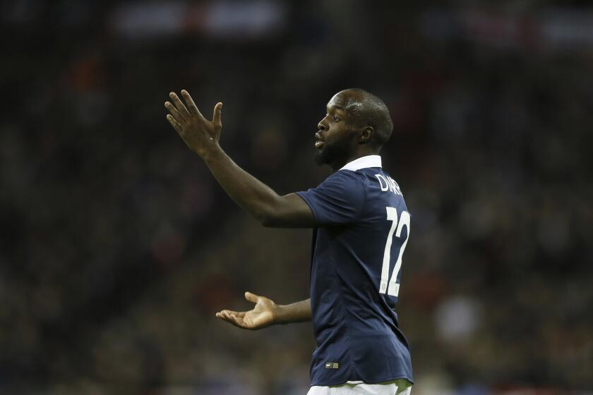 FILE - France's Lassana Diarra reacts during the international friendly soccer match between England and France at Wembley Stadium in London, Tuesday, Nov. 17, 2015. A senior legal adviser says some FIFA rules on transfer of players can be in breach of European Union legislation relating to competition and freedom of movement. Advocate General Maciej Szpunar gave an opinion on Tuesday after French soccer player Lassana Diarra challenged FIFA rules. (AP Photo/Kirsty Wigglesworth, File)