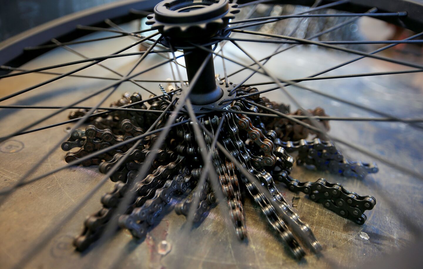 Shown is a closeup of some of the bicycle parts that artist Carolina Fontoura Alzaga uses to create chandeliers.