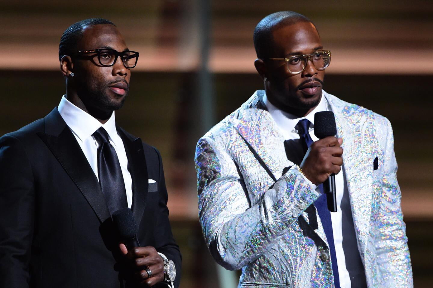NFL player Anquan Boldin and NFL player Von Miller announce nominees onstage.