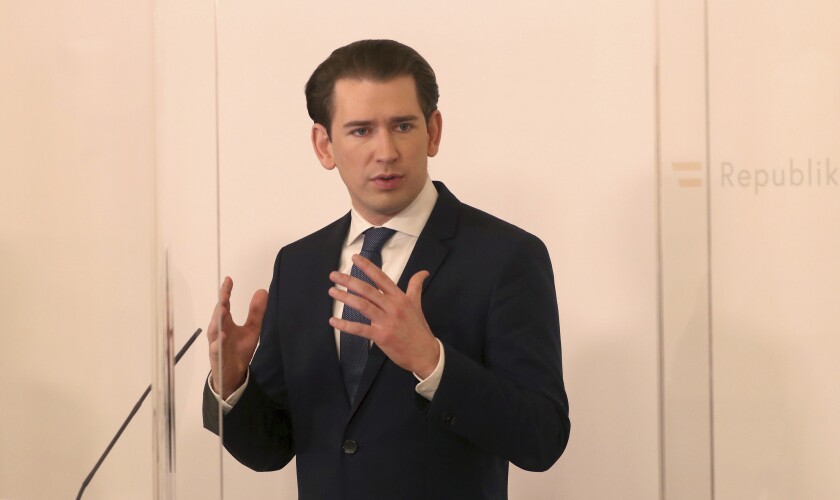 Austrian Chancellor Sebastian Kurz speaks behind a plastic shield at a press conference at the federal chancellery in Vienna, Austria, Monday, March 1, 2021. The Austrian government has moved to restrict freedom of movement for people, in an effort to slow the onset of the COVID-19 coronavirus. (AP Photo/Ronald Zak)