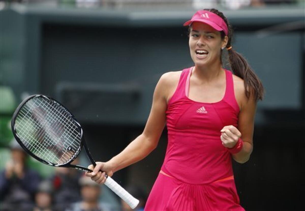 Ana Ivanovic of Serbia reacts after getting a point against Anastasia Rodionova of Australia during their first round match in the Japan Pan Pacific Open tennis tournament at Ariake Coliseum in Tokyo, Monday, Set. 26, 2011. Ivanovic won 6-4, 6-0. (AP Photo/Shizuo Kambayashi)