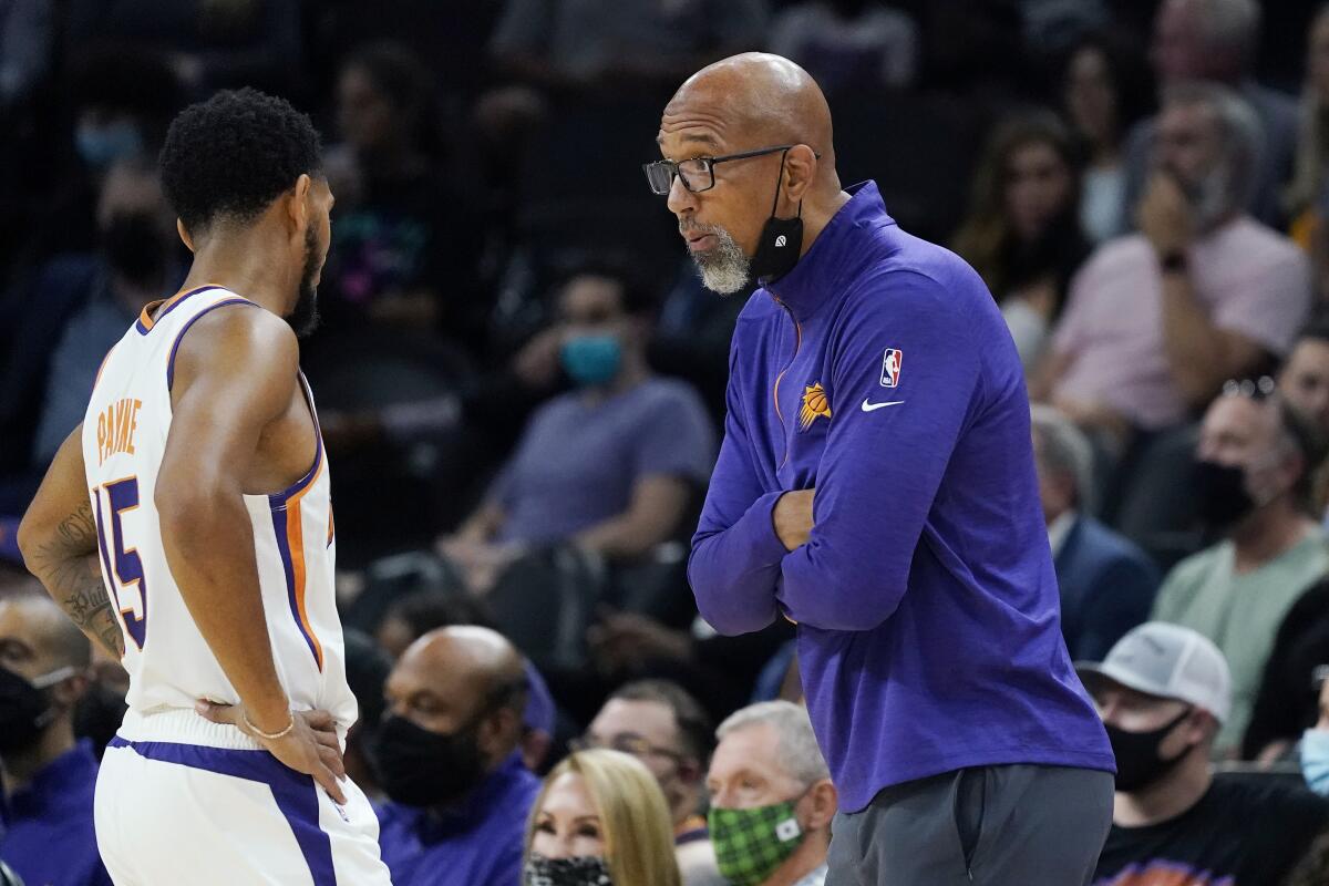Phoenix Suns coach Monty Williams, right, talks with guard Cameron Payne during the first half of the team's preseason NBA basketball game against the Los Angeles Lakers on Wednesday, Oct. 6, 2021, in Phoenix. The Suns won 117-105. (AP Photo/Ross D. Franklin)