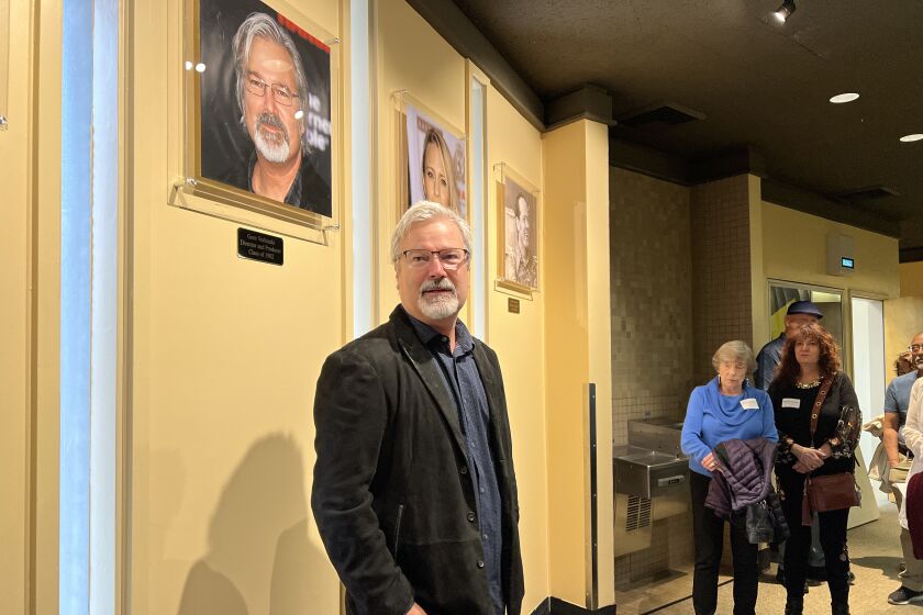 Film director and producer Gore Verbinski under his new photo on the La Jolla High School's theater Wall of Fame.