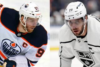Connor McDavid and Anze Kopitar side by side.