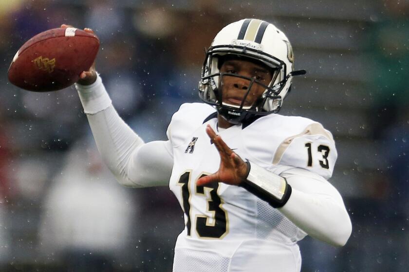 Quarterback Justin Holman will lead Central Florida into the Bitcoin St. Petersburg Bowl against North Carolina State on Friday.