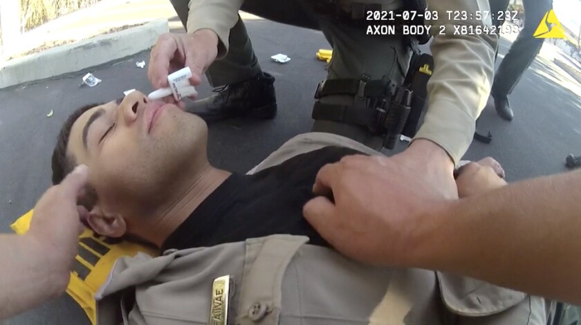 San Diego County Sheriff's Deputy David Faiivae gets aid after being exposed to fentanyl.