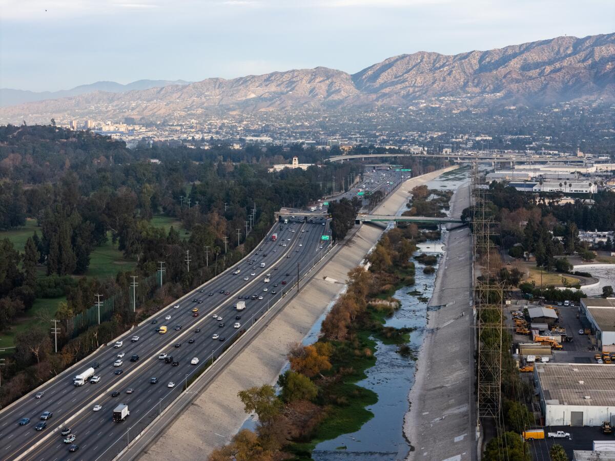 Water flows in the Los Angeles River, next to the 5 Freeway.