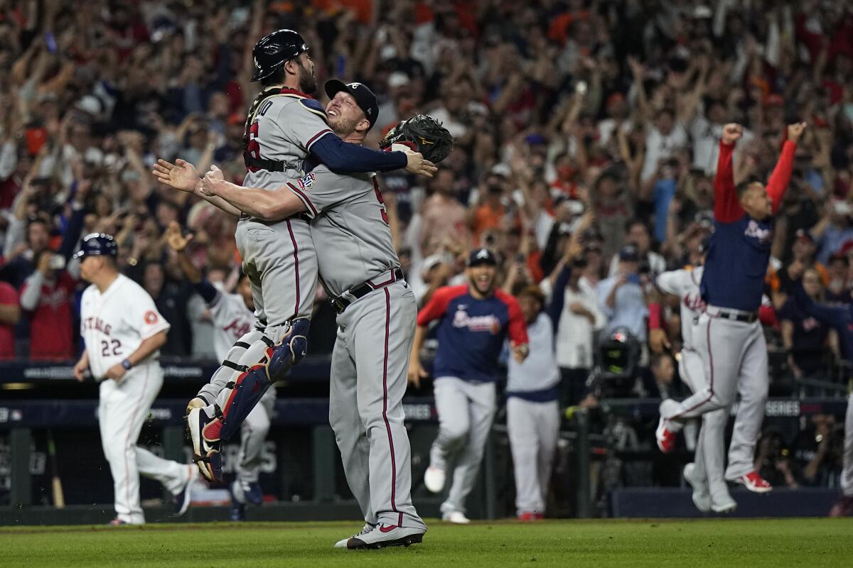 Atlanta Braves relief pitcher Will Smith and catcher Travis d'Arnaud celebrate after winning the World Series