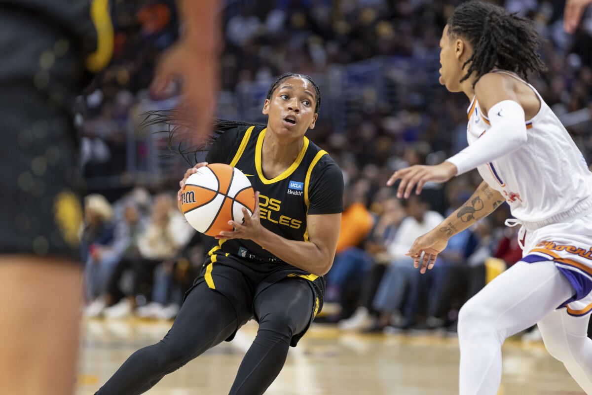 Sparks guard Zia Cooke drives to the basket against the Phoenix Mercury during a WNBA game.