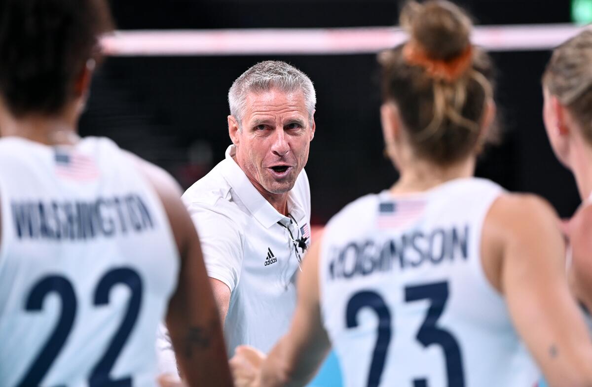 U.S. volleyball coach Karch Kiraly talks to his team during a match 