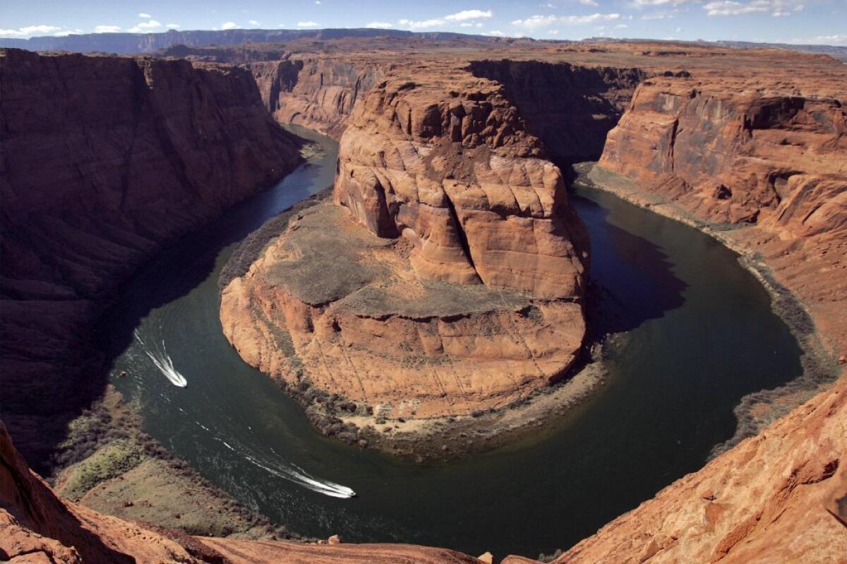 More frequent and intense droughts in the West may result in legal battles over the allocation of Colorado River water. Above, the river's Horseshoe Bend in Page, Ariz.