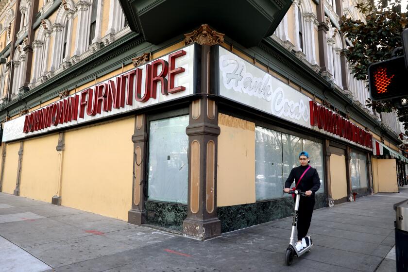 SAN JOSE, CA - MARCH 04: Hank Coca's Downtown Furniture slated for redevelopment along E Santa Clara St in downtown on Friday, March 4, 2022 in San Jose, CA. California is ground zero for the Opportunity Zone experiment, the idea is to lure investors into the nation's poorest census tracts by offering them lucrative tax breaks for development, drawing dollars and the associated jobs to the neighborhoods that are too often overlooked. Wealthy investors throughout the state have seized on its loopholes to grow their fortunes at the expense of government. (Gary Coronado / Los Angeles Times)