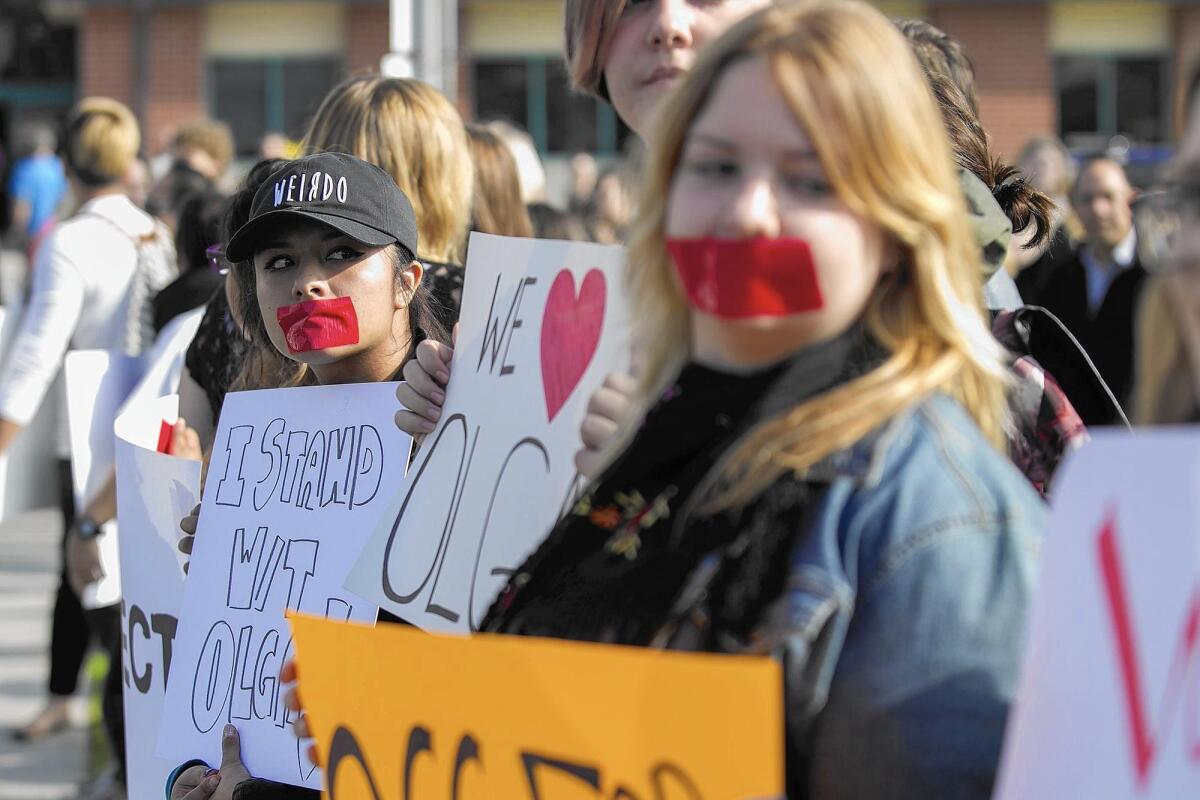 Students rally Monday in support of OCC professor Olga Perez Stable Cox, who was filmed in class making controversial remarks about President-elect Donald Trump’s election victory.