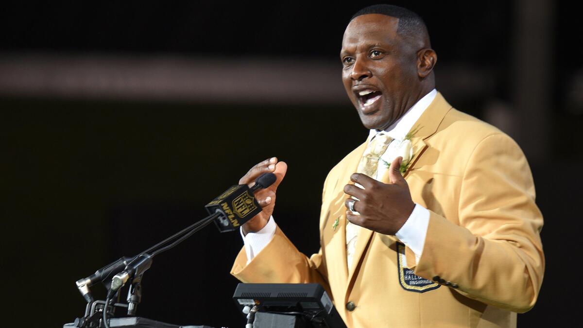 Tim Brown addresses the audience during his induction ceremony at the Pro Football Hall of Fame in 2015.
