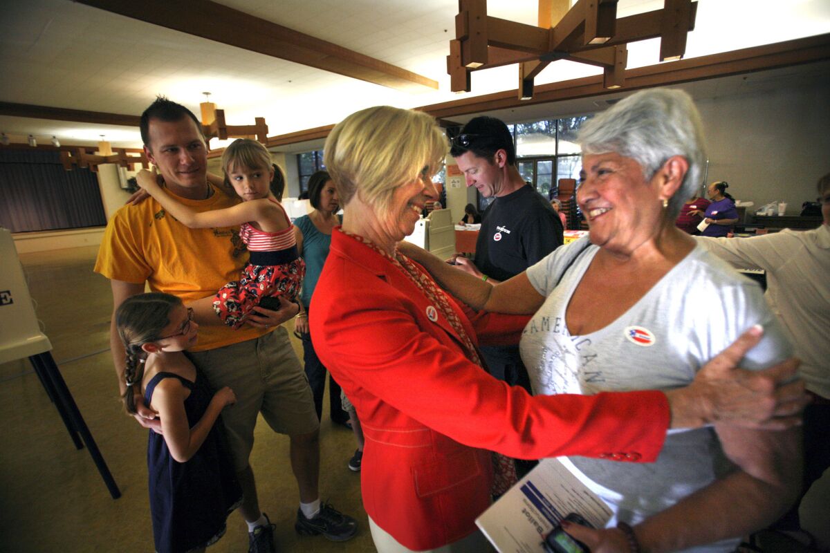 Rep. Janice Hahn greets Rosemary Mossbarger, right, at the Little Sisters of the Poor auditorium in San Pedro after Mossbarger cast her vote. Hahn ran five years ago and was reelected in 2012.