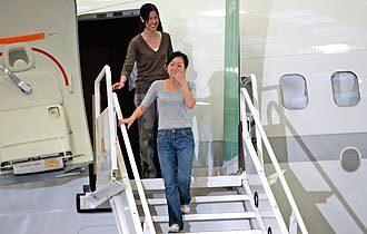 Euna Lee, front, and Laura Ling arrive at Bob Hope Airport in Burbank.
