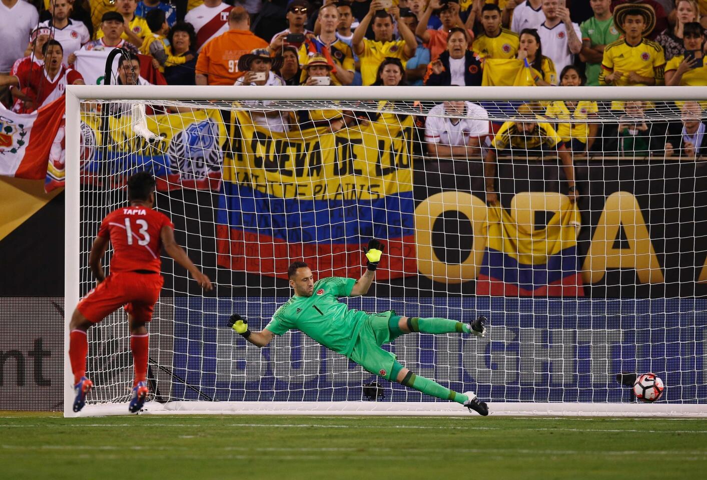 Colombia's goalkeeper David Ospina looks at the ball after Peru's Renato Tapia scored a penalty during the Copa America Centenario quarterfinal football match against Peru in East Rutherford, New Jersey, United States, on June 17, 2016. / AFP PHOTO / Eduardo Munoz AlvarezEDUARDO MUNOZ ALVAREZ/AFP/Getty Images ** OUTS - ELSENT, FPG, CM - OUTS * NM, PH, VA if sourced by CT, LA or MoD **