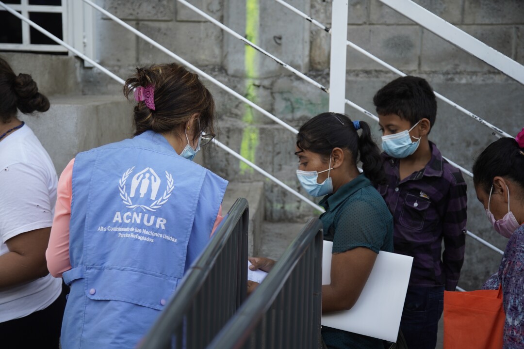 Asylum seekers wait in line for help at the U.N. Refugee Agency