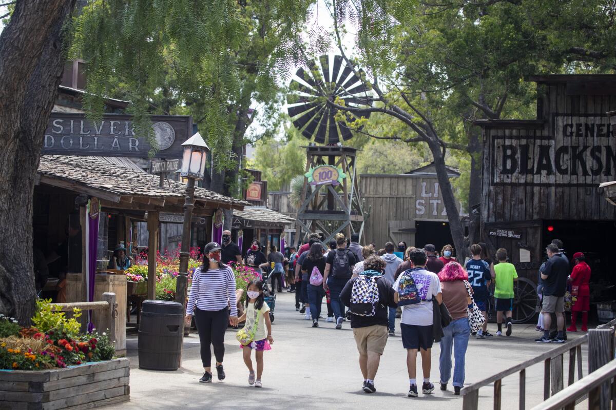 Patrons stroll through the Old West Ghost Town at Knott's Berry Farm