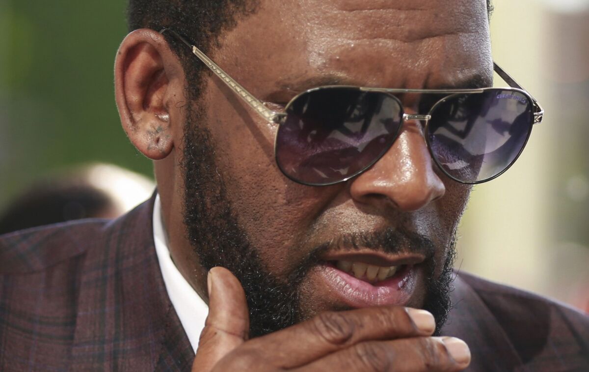 FILE - This photo from Wednesday June 26, 2019, shows R&B singer R. Kelly arriving at the Leighton Criminal Court in Chicago for arraignment on sex-related charges. Federal prosecutors in New York on Friday, July 23, 2021 asked a judge for permission to admit more evidence for which Kelly has not been charged, at his upcoming sex-trafficking trial in Brooklyn. (AP Photo/Amr Alfiky, File)