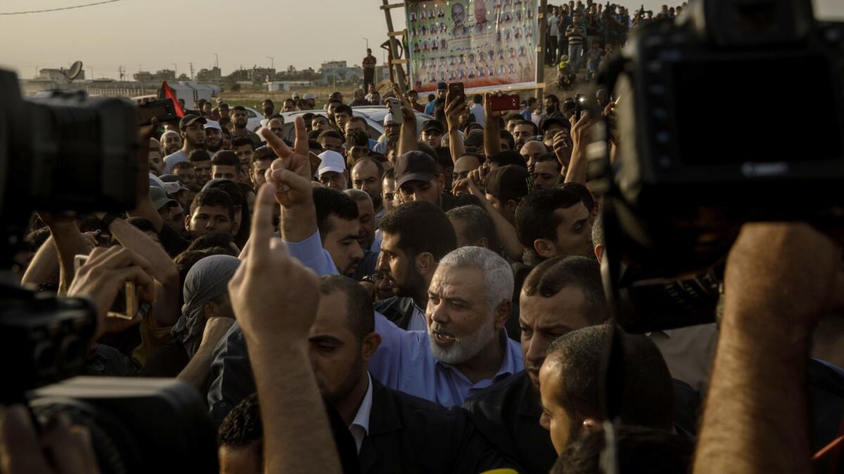 Hamas leader Ismail Haniyeh rallies protesters Friday at the Gaza Strip's border with Israel.