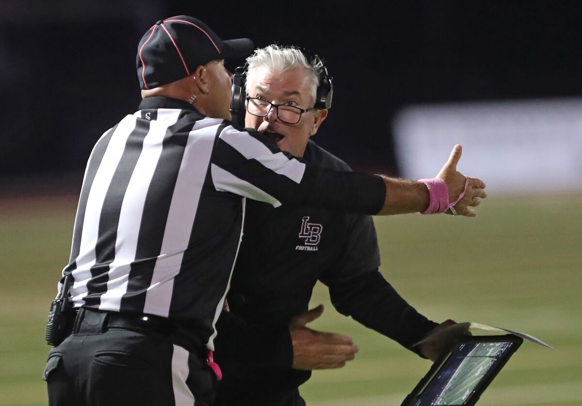 Laguna Beach head coach John Shanahan disagrees with a call from the referees against Westminster on Friday.