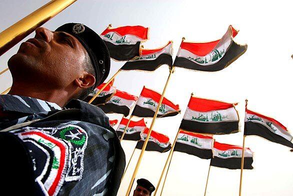 Iraqi soldiers parade in the city of Karbala.