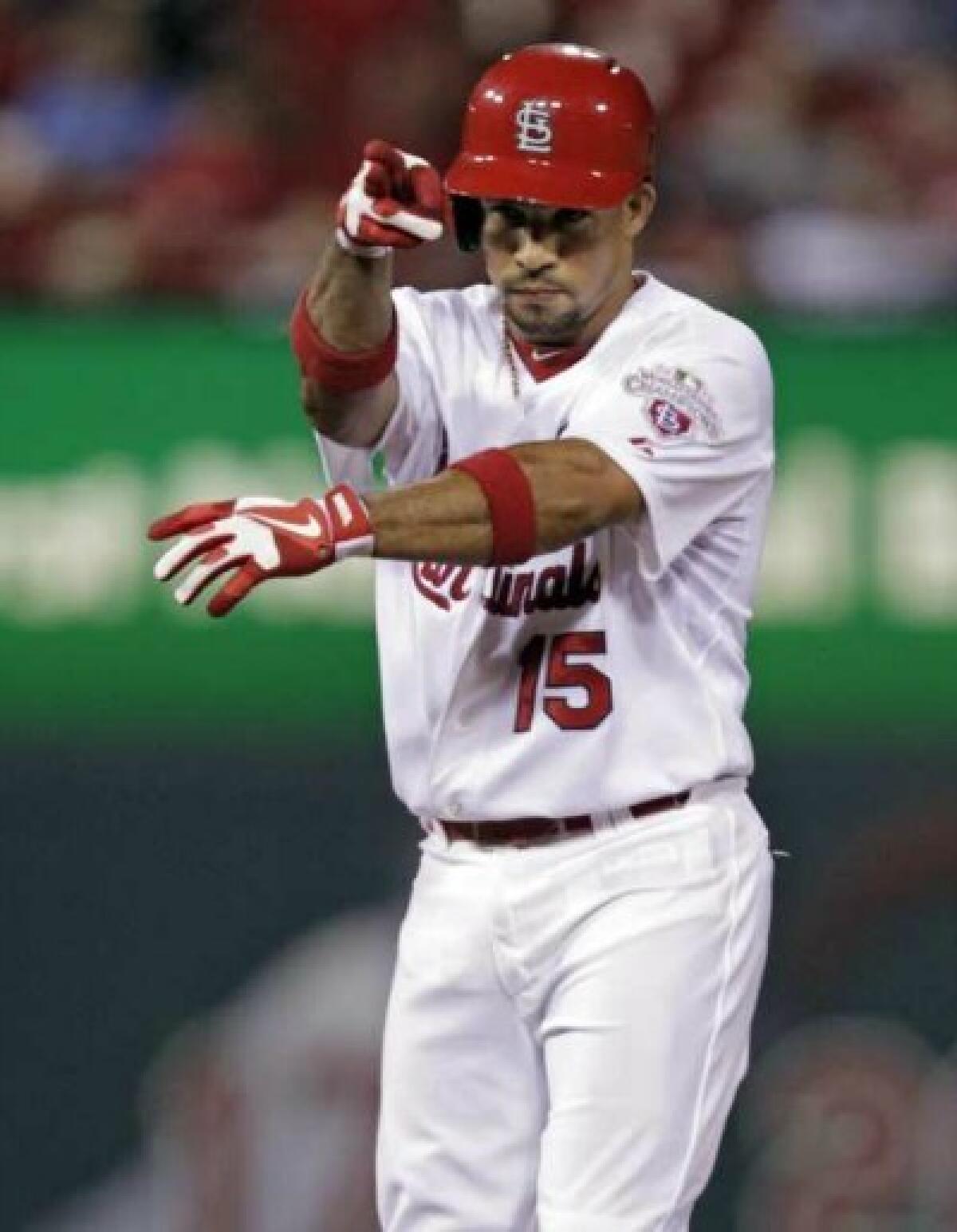 St. Louis Cardinal Rafael Furcal gestures back to the dugout after hitting a double in the third inning of a baseball game against the Arizona Diamondbacks Aug. 16 in St. Louis.