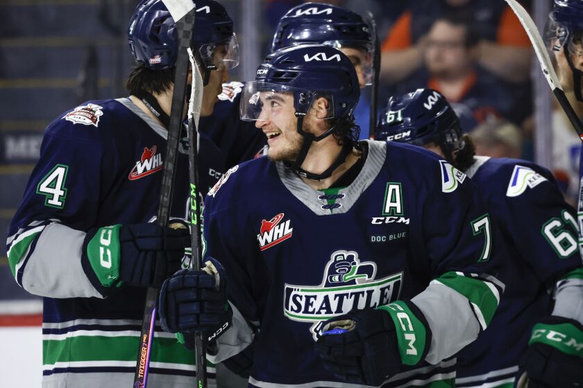 Seattle Thunderbirds forward Jordan Gustafson, center, celebrates his goal against the Kamloops Blazers with teammates during the second period of a CHL Memorial Cup hockey game Wednesday, May 31, 2023, in Kamloops, British Columbia. (Jeff McIntosh/The Canadian Press via AP)