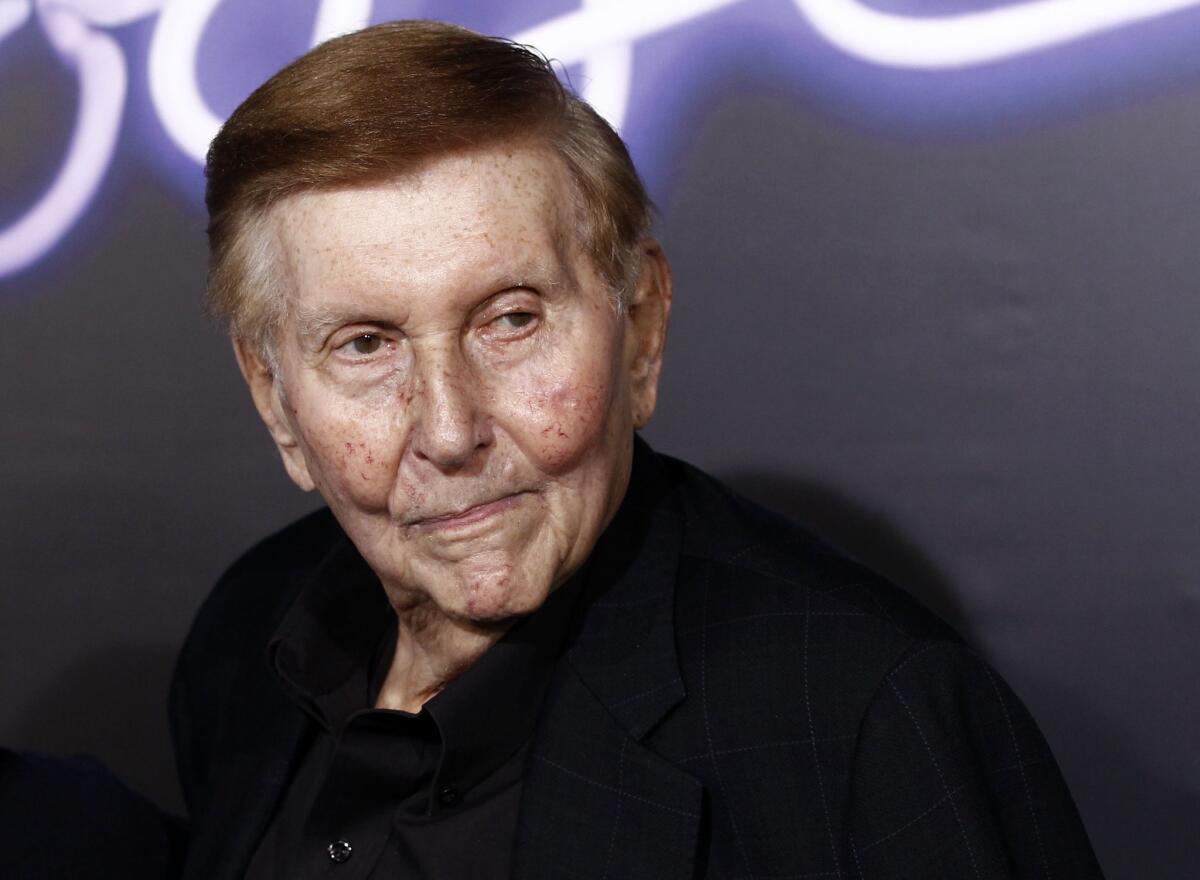 Sumner Redstone arrive at the premiere of "Footloose" in Los Angeles in 2011.