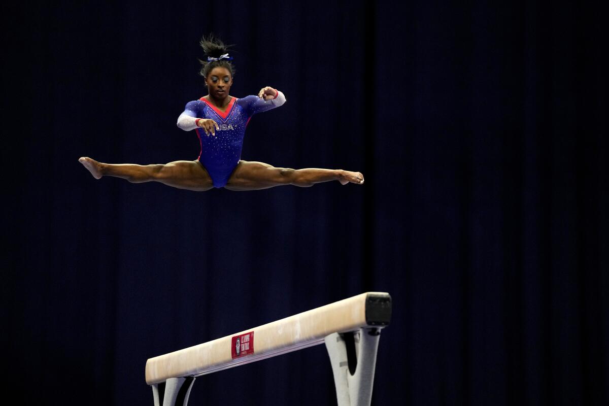 Simone Biles competes on the balance beam during the women's U.S. Olympic trials June 25, 2021.