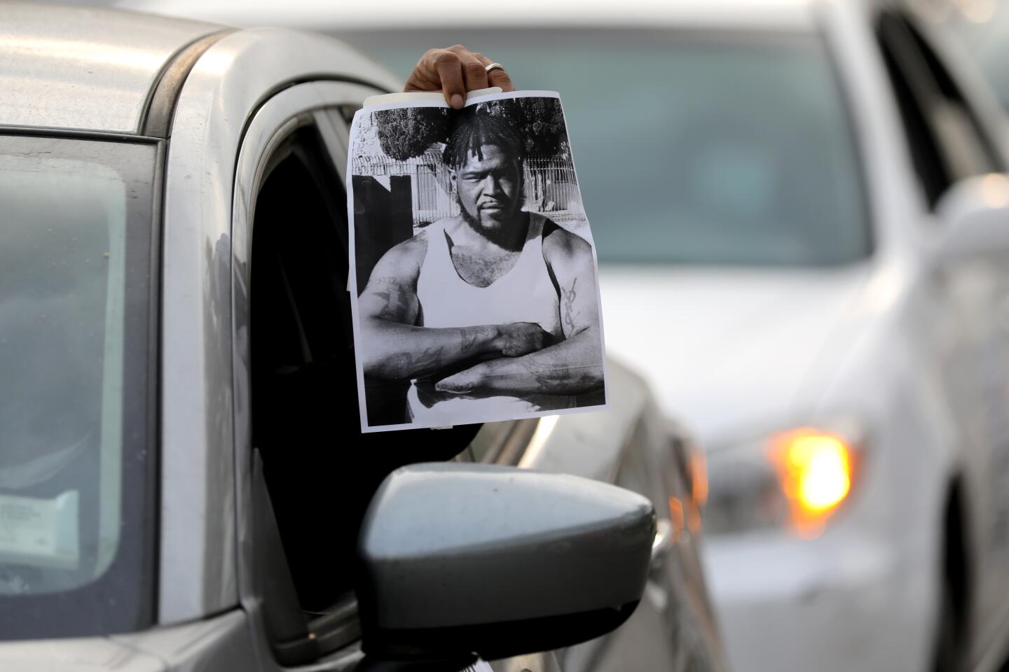 Revolution Club LA caravans Tuesday throughout a South Los Angeles neighborhood protesting the shooting of Dijon Kizzee