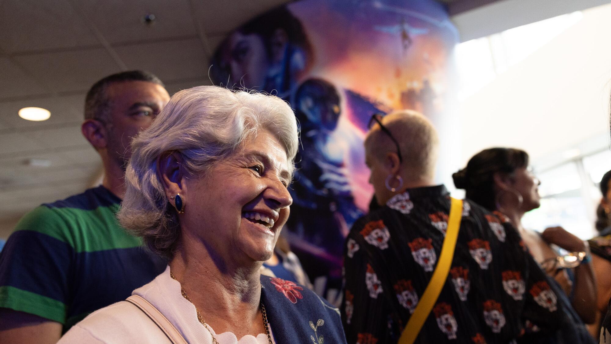 Xolo Maridueña's grandmother smiles at a movie screening.