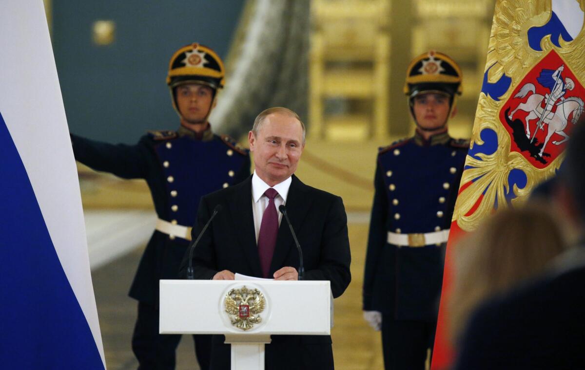 Russian President Vladimir Putin speaks during a farewell ceremony for the Olympic team Wednesday at the Grand Kremlin Palace.