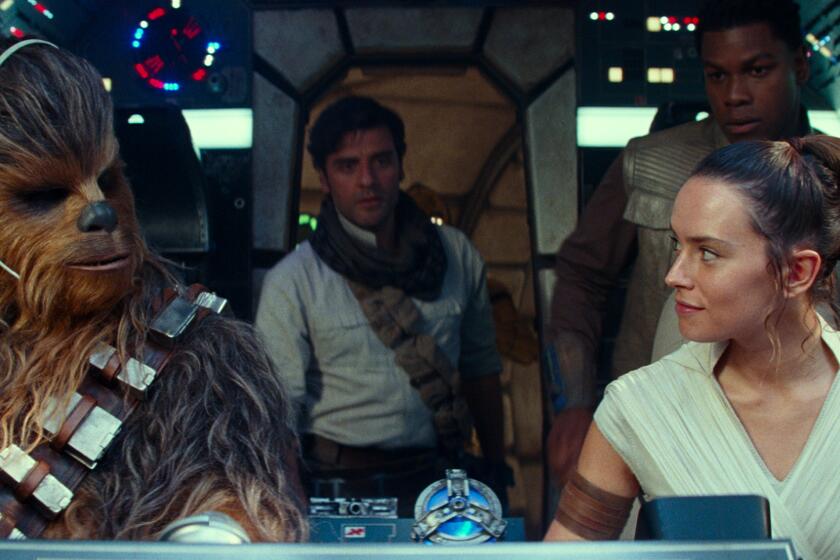 This image released by Disney/Lucasfilm shows, from left, Joonas Suotamo as Chewbacca, Oscar Isaac as Poe Dameron, Daisy Ridley as Rey and John Boyega as Finn in a scene from "Star Wars: The Rise of Skywalker." (Disney/Lucasfilm Ltd. via AP)