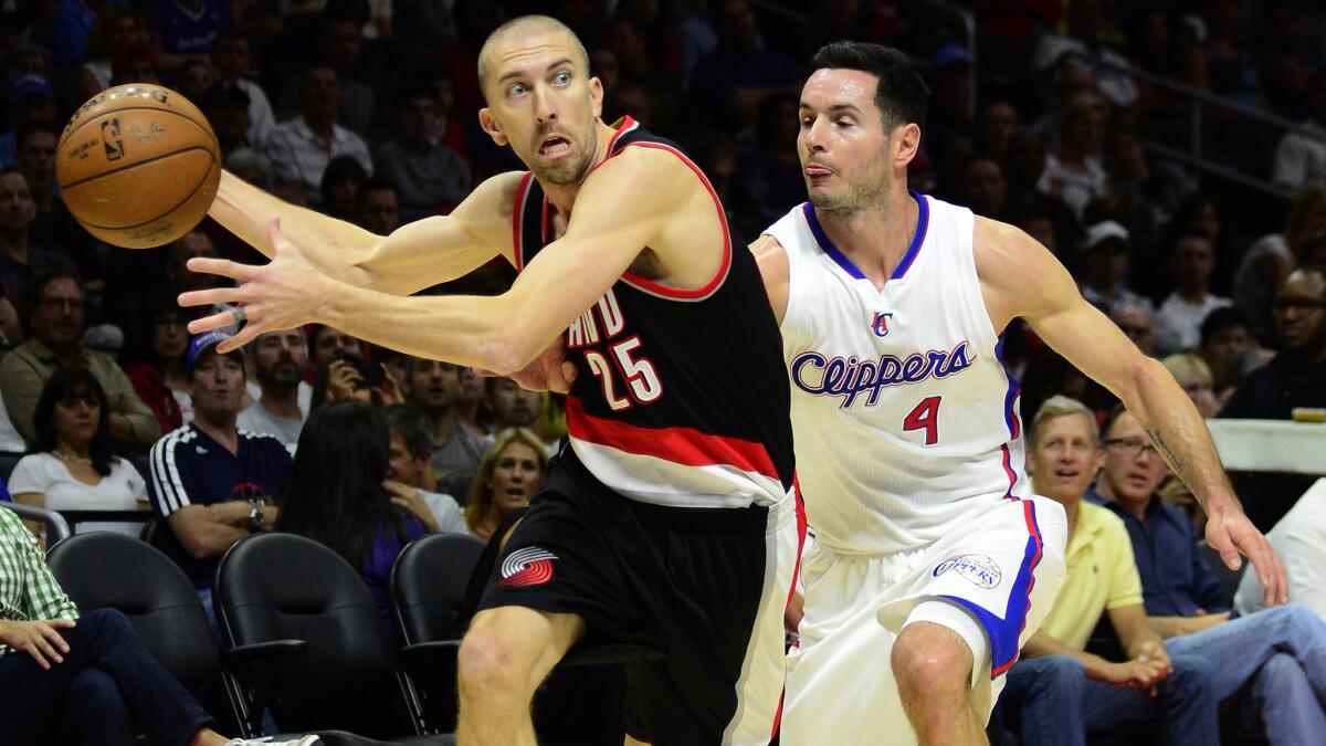 Portland Trail Blazers guard Steve Blake, left, drives past Clippers guard J.J. Redick during the first half of Saturday's game at Staples Center.