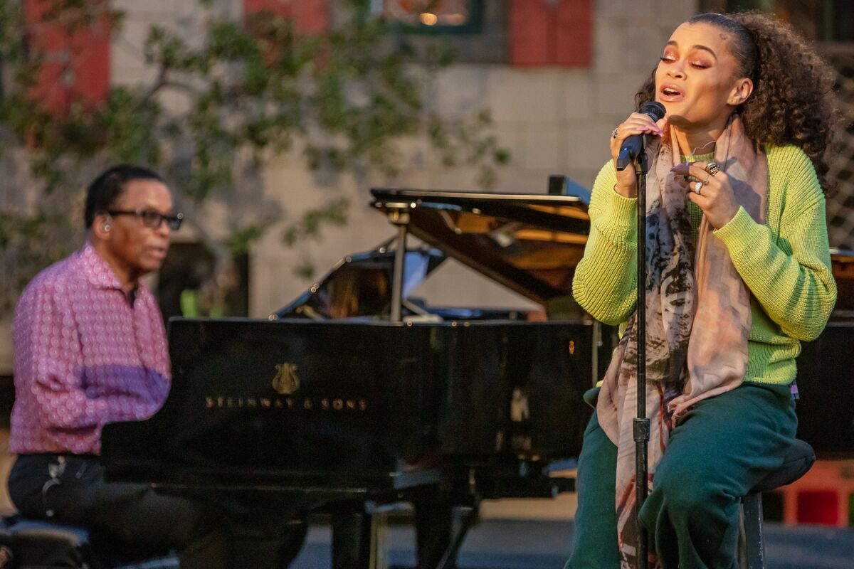 Herbie Hancock on piano and Andra Day singing.